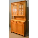 A Late 19th Century French Pine Dresser, The Moulded Cornice above two glazed doors, the lower