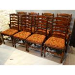 A Set Of Eight, Six Plus Two Ladder Back Dining Chairs With Drop In Seats, raised upon turned legs