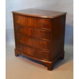 A Reproduction Mahogany Bow Fronted Chest The Moulded Top above four long drawers with metal