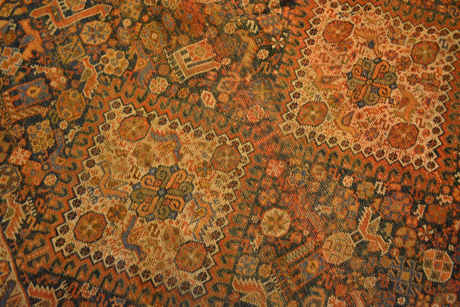 A North West Persian Woollen Carpet With Four Central Medallions within an all over design upon a - Image 2 of 3