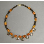 A Quartz And Amber Necklace With 9ct. Gold Clasp