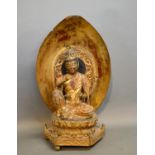 A Carved Wooden Model In The Form Of Buddha Hexagonal Base and lacquered back, 56cm tall