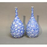A Pair Of Japanese Under Glazed Blue Decorated Bottle Neck Vases of Oviform, 24cm tall