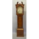 A George III Oak Long Case Clock The Arched Hood with swan neck pediment above a rectangular door