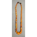 A Graduated Amber Bead Necklace