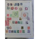 An Old Time collection in a large century postage stamp album - A remaindered collection with some