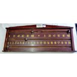An antique oak and brass score board by J Pemberton + Sons (Sports) Ltd, Leeds -est. 1860