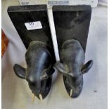 A pair of Black wooden elephants book stands - with one tusk missing
