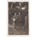 Norfolk Regiment(Cyclist) WWI- 1914 RP postcard of two soldiers-one with his rifle on his bicycle,