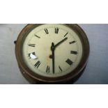 Clock-Heavy Brass Ships Clock- Roman numbers, needs some attention no key in good condition