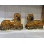 STAFFORDSHIRE POTTERY, pair of resting lions, glass inset eyes,