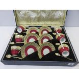 AYNSLEY original cased 12 setting gilded and red border coffee ware with enamelled HM silver gilt