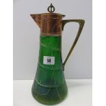 ART NOUVEAU GLASSWARE, an iridescent green glass base claret jug with copper and brass mounts 10.