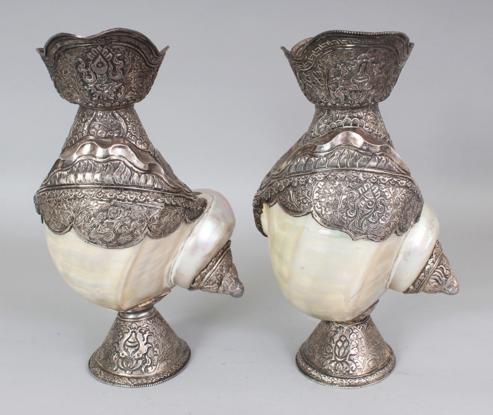 AN UNUSUAL PAIR OF TIBETAN SILVER-METAL MOUNTED NAUTILUS SHELLS, each shell with elaborately - Image 2 of 8