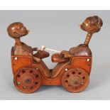 A GOOD JAPANESE MEIJI PERIOD WOOD & IVORY KOBE TOY, constructed in the form of two figures sitting