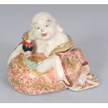 A JAPANESE MEIJI PERIOD KYOTO EARTHENWARE FIGURE OF HOTEI, leaning on his bag, the bag and his robes