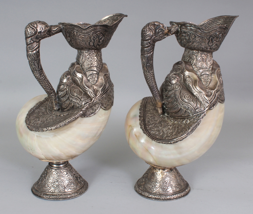 AN UNUSUAL PAIR OF TIBETAN SILVER-METAL MOUNTED NAUTILUS SHELLS, each shell with elaborately - Image 3 of 8