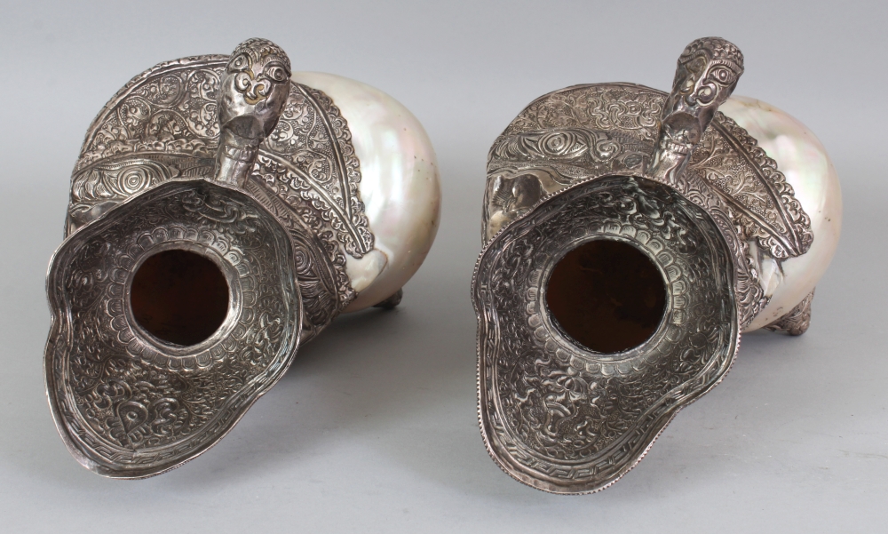 AN UNUSUAL PAIR OF TIBETAN SILVER-METAL MOUNTED NAUTILUS SHELLS, each shell with elaborately - Image 7 of 8