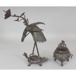 A JAPANESE MEIJI PERIOD SECTIONAL BRONZE PRICKET CANDLESTICK, in the form of a lotus-bearing stork