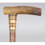 A RHINO HORN HANDLED BAMBOO MASONIC WALKING STICK, with a gilt-plated collar bearing impressed marks