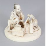 A JAPANESE MEIJI PERIOD SECTIONAL IVORY OKIMONO OF A SEATED BASKET MAKER, his implements before him,