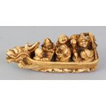 A GOOD QUALITY SIGNED JAPANESE MEIJI PERIOD IVORY NETSUKE, carved in the form of the Seven Lucky