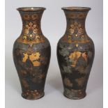 A PAIR OF SIGNED EARLY 20TH CENTURY JAPANESE MIXED METAL STYLE VASES, each with elaborate decoration