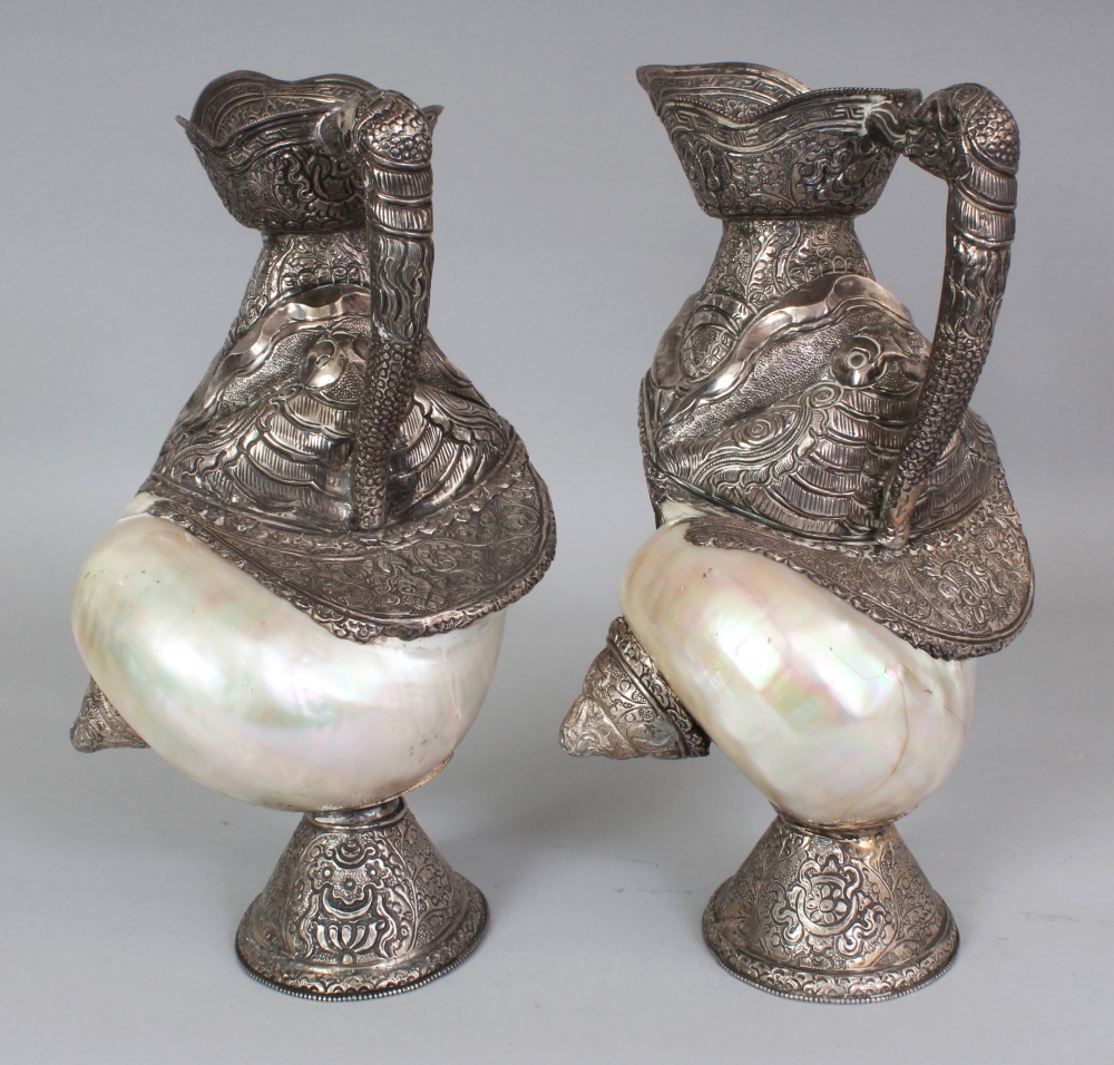 AN UNUSUAL PAIR OF TIBETAN SILVER-METAL MOUNTED NAUTILUS SHELLS, each shell with elaborately - Image 4 of 8