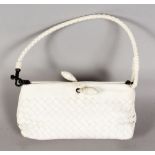 A BOTTEGA VENETA SMALL WHITE WOVEN LEATHER HANDBAG.