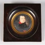 A CIRCULAR MINIATURE OF A MAN IN A BLACK COAT. 2.25ins diameter.