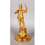 A 19TH CENTURY GILDED METAL TABLE LIGHTER as a man in top hat holding a bottle. 9.5ins high.