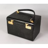 A LADIES HARD CROCODILE SKIN VANITY CASE.