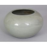 A CHINESE CELADON GLAZED PORCELAIN BRUSHWASHER, the base with a Qianlong seal mark, 4.75in wide at