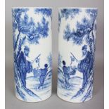 A MIRROR PAIR OF CHINESE REPUBLIC STYLE BLUE & WHITE PORCELAIN HAT STANDS, each decorated with