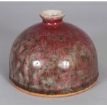A CHINESE PEACH BLOOM PORCELAIN BEEHIVE WATER POT, the red streaked glaze with green inclusions, 4.