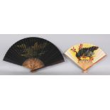 A 20TH CENTURY CHINESE BLACK GROUND GILT DECORATED PAPER FAN, with bamboo sticks, approx. 17in