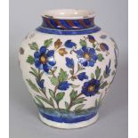 A PERSIAN ISNIK STYLE CERAMIC VASE, the base unglazed, 7.1in high.