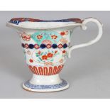 AN EARLY 20TH CENTURY JAPANESE IMARI PORCELAIN MILK JUG, 6.6in long including handle & 4.75in high.