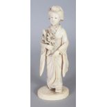 A GOOD QUALITY SIGNED JAPANESE MEIJI PERIOD IVORY OKIMONO OF A BIJIN, bearing a flower spray and