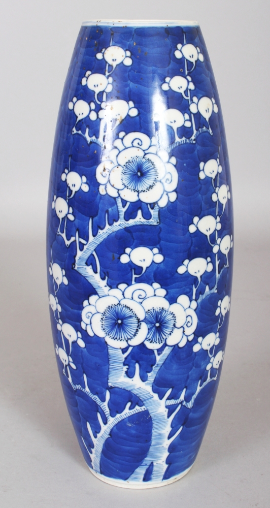 A 19TH CENTURY BLUE & WHITE OVAL FORM PORCELAIN PRUNUS VASE, the base with a four-character Kangxi