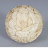 A JAPANESE MEIJI PERIOD CARVED IVORY SPHERE-FORM BOX, opening with a screw action, the sides