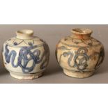 A SIMILAR PAIR OF CHINESE WANLI PERIOD SHIPWRECK BLUE & WHITE PORCELAIN JARS. (from the collection