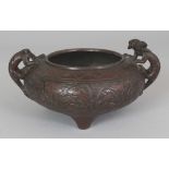 A CHINESE BRONZE TRIPOD CENSER, the base cast with a six-character Xuande mark, 6.9in wide including