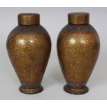 A PAIR OF 19TH/20TH CENTURY KASHMIRI LACQUER VASES & COVERS, each with formal foliate decoration,