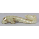 A CHINESE CELADON JADE BELT HOOK, 3.25in long.