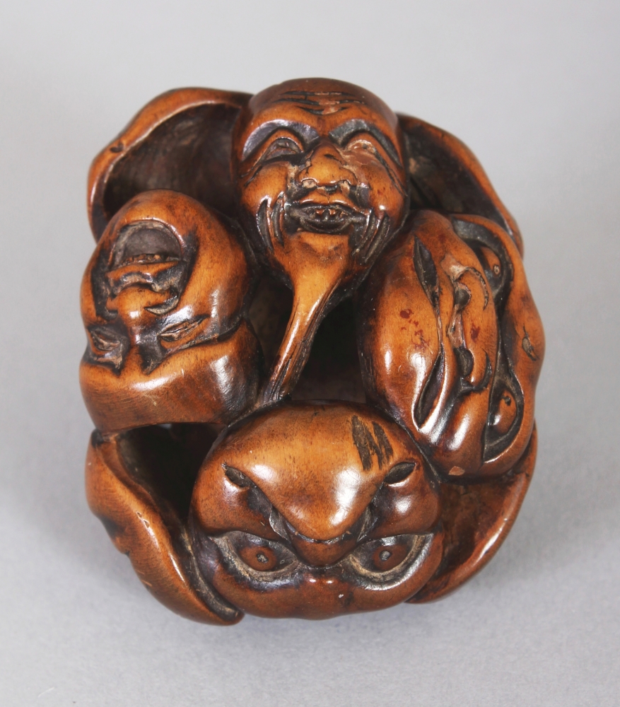 A GOOD QUALITY JAPANESE MEIJI PERIOD WOOD NOH MASK NETSUKE, carved and pierced with nine - Image 2 of 2