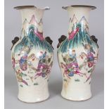 A MIRROR PAIR OF CHINESE FAMILLE ROSE CRACKLEGLAZE WARRIOR VASES, circa 1900, 15in high.