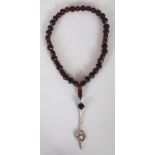 A GOOD QUALITY 'CHERRY AMBER' NECKLACE, weighing approx. 87gm including the metal fittings, the