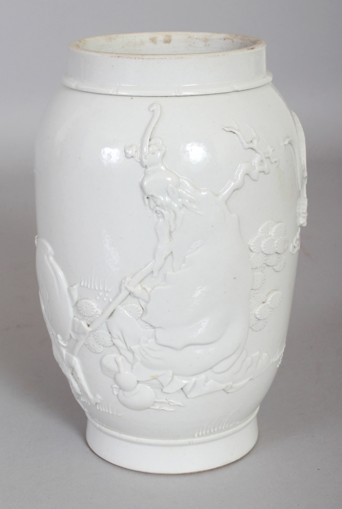 A CHINESE WHITE GLAZED WANG BINRONG TYPE MOULDED PORCELAIN JAR, the sides decorated in relief with