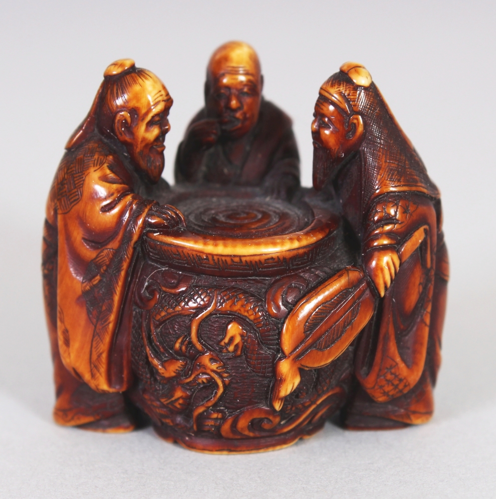 A GOOD QUALITY JAPANESE MEIJI PERIOD STAINED IVORY NETSUKE BY GYOKUZAN, carved in the form of